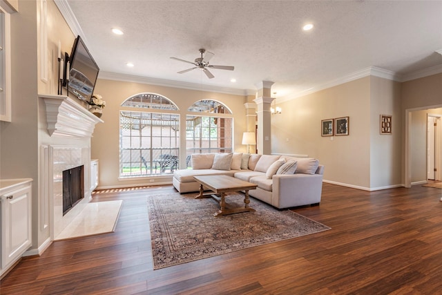 1907 Garden Fern Ct, Houston, TX 77062 - living room with a ceiling fan, dark wood finished floors, recessed lighting, a fireplace, and a textured ceiling