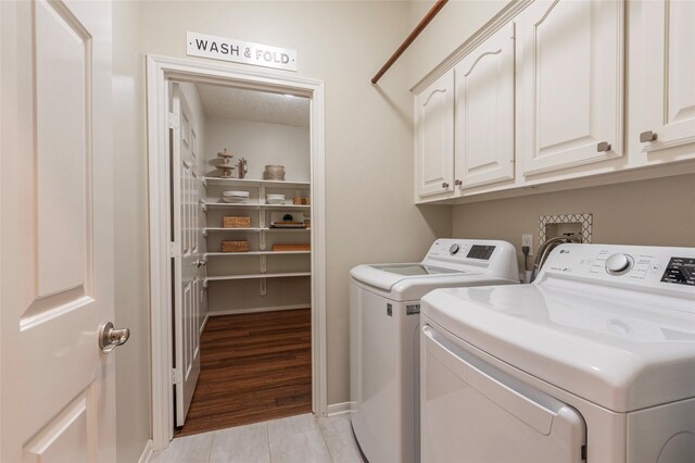 1907 Garden Fern Ct, Houston, TX 77062 - laundry room with washer and clothes dryer and cabinet space