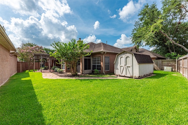 1907 Garden Fern Ct, Houston, TX 77062 - back of house featuring a storage shed, brick siding, a fenced backyard, a patio, and a pergola