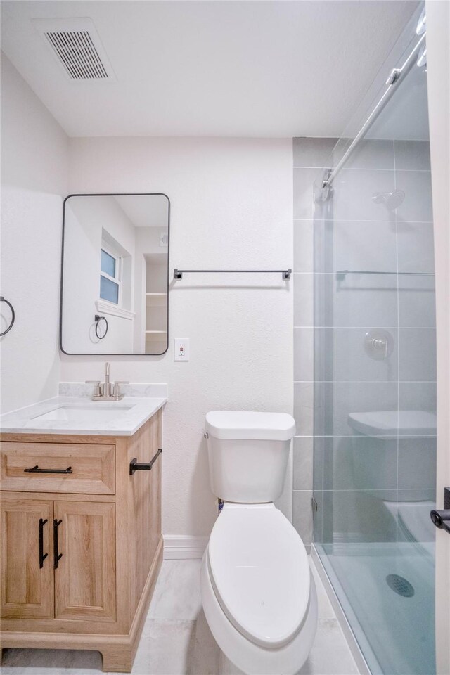 2703 Mason St Unit 13, Houston, TX 77006 - bathroom featuring vanity, a shower stall, and tile patterned floors