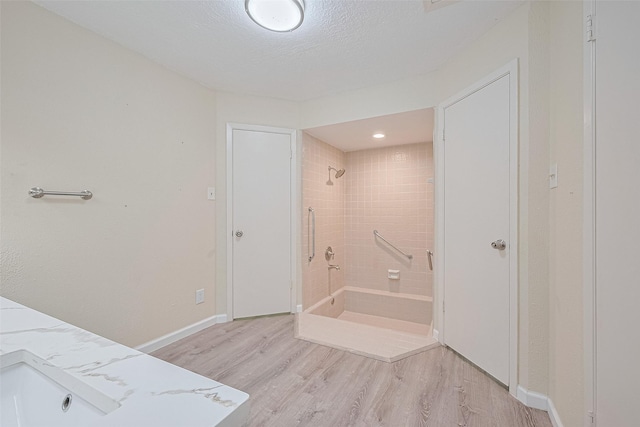2107 Shadowbriar Dr, Houston, TX 77077 - full bath featuring a shower, wood finished floors, and vanity