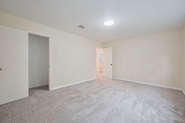 2107 Shadowbriar Dr, Houston, TX 77077 - unfurnished bedroom with carpet and a textured ceiling