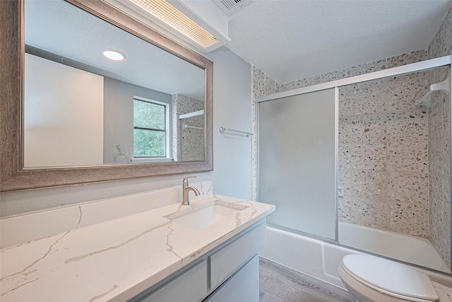 2107 Shadowbriar Dr, Houston, TX 77077 - full bathroom with vanity, combined bath / shower with glass door, and wood finished floors