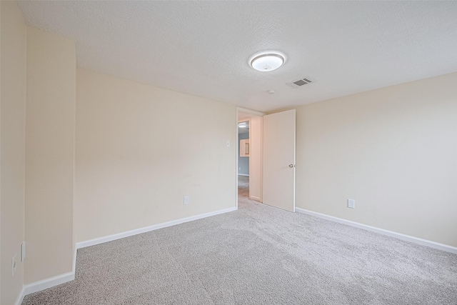 2107 Shadowbriar Dr, Houston, TX 77077 - carpeted spare room with a textured ceiling and baseboards