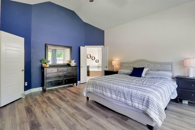 27163 Allenby Park Dr, Magnolia, TX 77354 - bedroom featuring high vaulted ceiling, wood finished floors, connected bathroom, and a ceiling fan