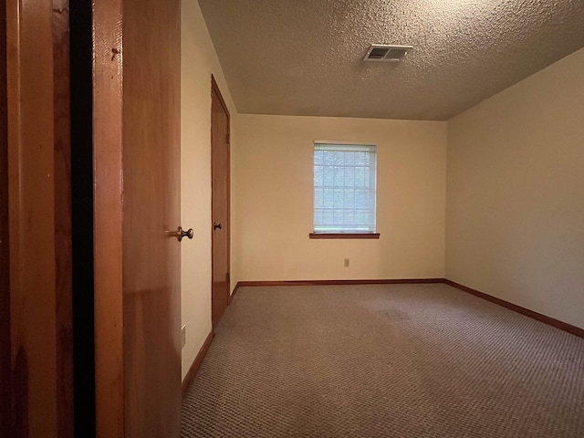 7541 Werner St, Houston, TX 77037 - unfurnished room with carpet flooring and a textured ceiling