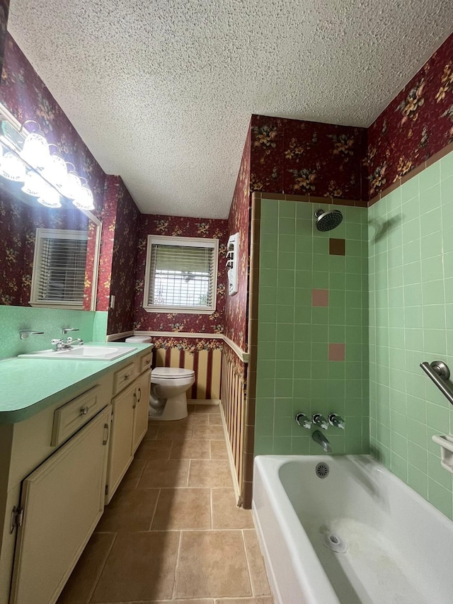 7541 Werner St, Houston, TX 77037 - full bathroom with wallpapered walls, a textured ceiling, vanity, shower / washtub combination, and tile patterned floors