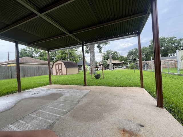 7541 Werner St, Houston, TX 77037 - fenced backyard featuring a patio and a storage unit