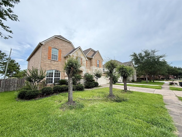 12503 Pepper Creek Ln, Pearland, TX 77584 - view of front facade with driveway, brick siding, and stone siding