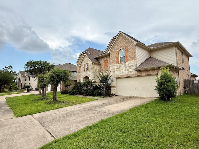 12503 Pepper Creek Ln, Pearland, TX 77584 - view of front of home with driveway, an attached garage, roof with shingles, stone siding, and brick siding