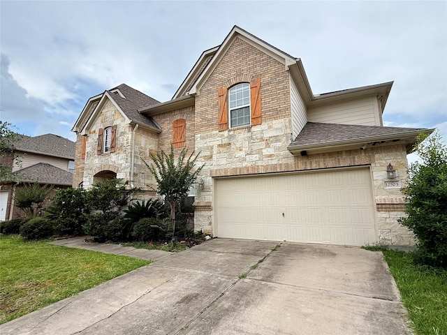 12503 Pepper Creek Ln, Pearland, TX 77584 - french country inspired facade featuring stone siding, driveway, roof with shingles, and a garage