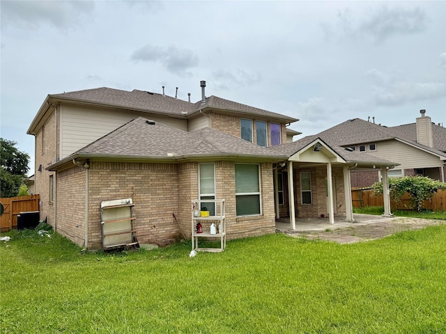12503 Pepper Creek Ln, Pearland, TX 77584 - back of property with a patio, brick siding, and a shingled roof