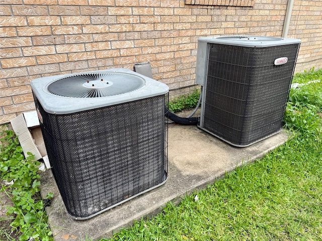 12503 Pepper Creek Ln, Pearland, TX 77584 - exterior view of a central air condition unit and brick siding