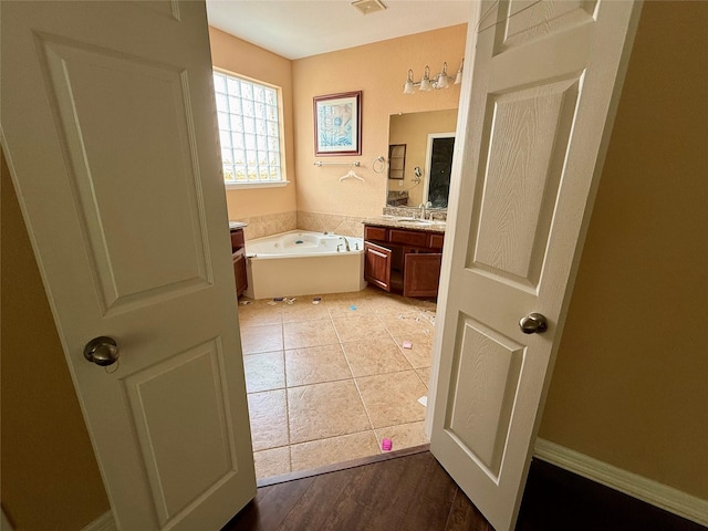 12503 Pepper Creek Ln, Pearland, TX 77584 - bathroom with vanity, a bath, and tile patterned flooring