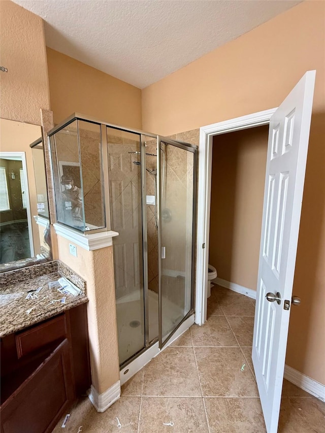 12503 Pepper Creek Ln, Pearland, TX 77584 - full bath with a textured ceiling, a stall shower, vanity, and tile patterned flooring