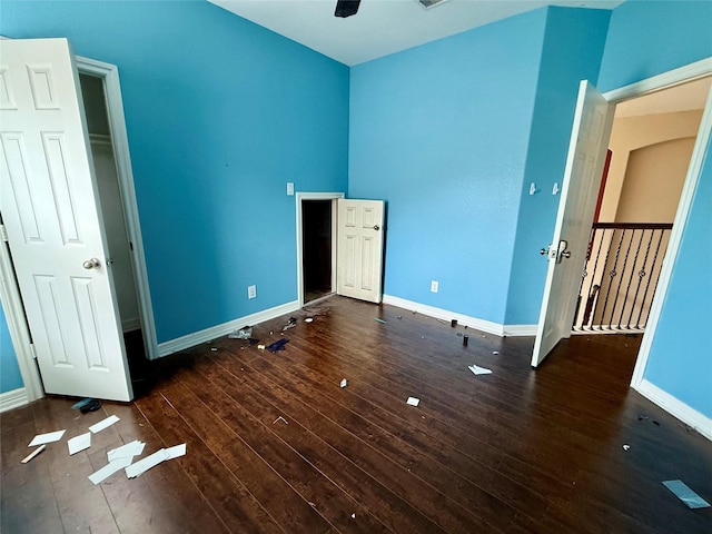 12503 Pepper Creek Ln, Pearland, TX 77584 - unfurnished bedroom featuring hardwood / wood-style floors and baseboards