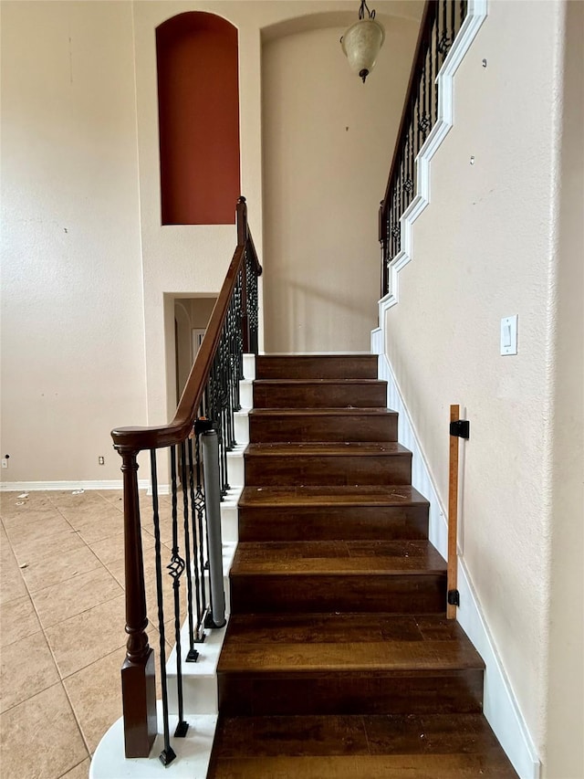 12503 Pepper Creek Ln, Pearland, TX 77584 - staircase featuring tile patterned floors and baseboards