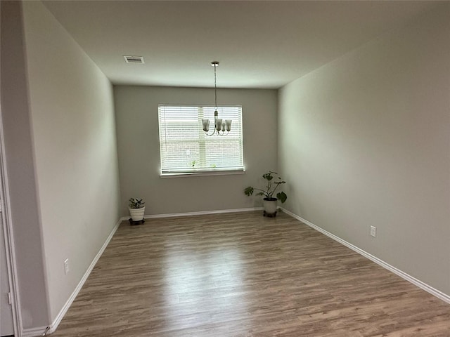 6106 Yesenia St, Katy, TX 77449 - unfurnished dining area with a chandelier and wood finished floors