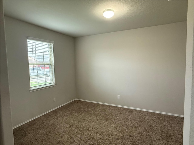 6106 Yesenia St, Katy, TX 77449 - spare room with dark carpet and baseboards