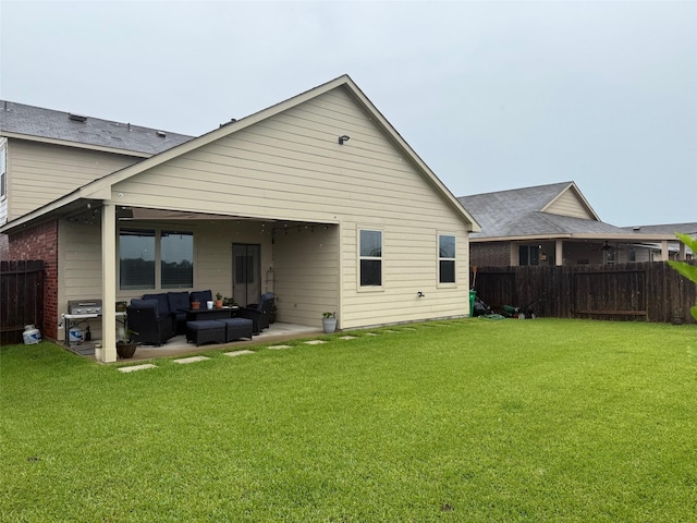 6106 Yesenia St, Katy, TX 77449 - back of house featuring an outdoor living space and a patio area