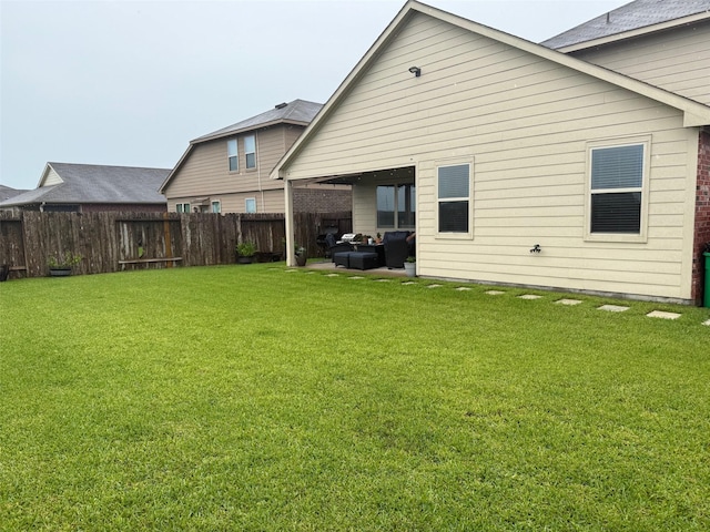 6106 Yesenia St, Katy, TX 77449 - rear view of property with a fenced backyard, an outdoor living space, and a patio