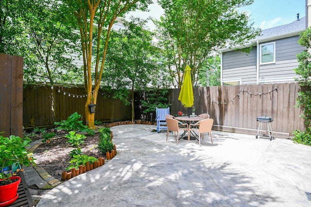 1307 W Bell St, Houston, TX 77019 - fenced backyard with outdoor dining space and a patio