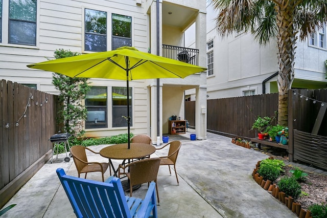 1307 W Bell St, Houston, TX 77019 - fenced backyard with a patio, outdoor dining area, and a grill