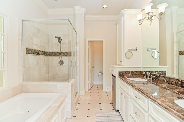 1307 W Bell St, Houston, TX 77019 - bathroom featuring a stall shower, a tub with jets, double vanity, crown molding, and tile patterned floors