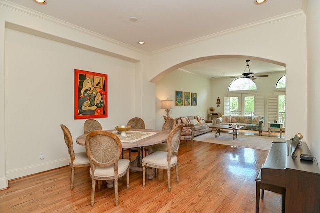 1307 W Bell St, Houston, TX 77019 - dining area featuring arched walkways, a ceiling fan, crown molding, light wood-type flooring, and recessed lighting