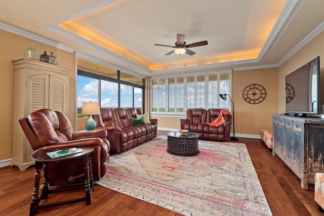 14655 Champion Forest Dr Unit 1704, Houston, TX 77069 - living area featuring a tray ceiling, a ceiling fan, crown molding, and dark wood-style flooring