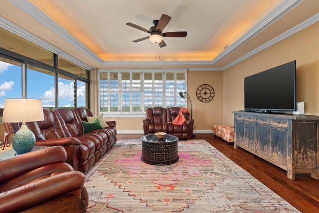 14655 Champion Forest Dr Unit 1704, Houston, TX 77069 - living area with a tray ceiling, ceiling fan, dark wood-type flooring, and crown molding