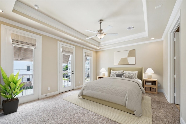 1516 Cohn St, Houston, TX 77007 - carpeted bedroom featuring a tray ceiling, access to outside, ornamental molding, and a ceiling fan