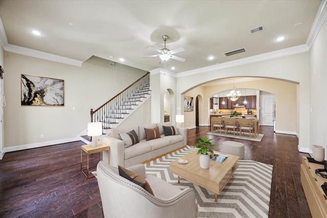1516 Cohn St, Houston, TX 77007 - living room with arched walkways, hardwood / wood-style flooring, ornamental molding, a ceiling fan, and a chandelier