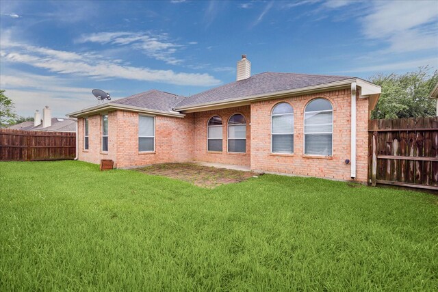 20779 Oakhurst Meadows Dr, Porter, TX 77365 - rear view of property with brick siding, a fenced backyard, a chimney, and roof with shingles
