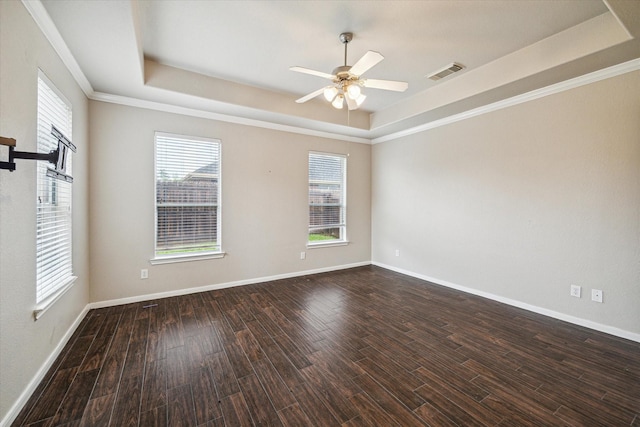 20779 Oakhurst Meadows Dr, Porter, TX 77365 - spare room featuring a tray ceiling, ceiling fan, dark wood-type flooring, and crown molding