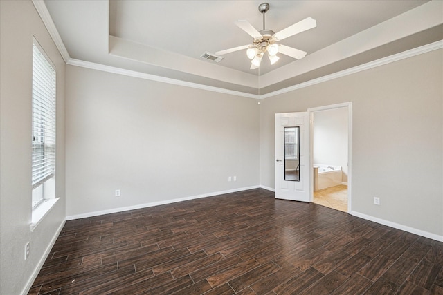 20779 Oakhurst Meadows Dr, Porter, TX 77365 - unfurnished room with a tray ceiling, dark wood-style floors, a ceiling fan, and crown molding