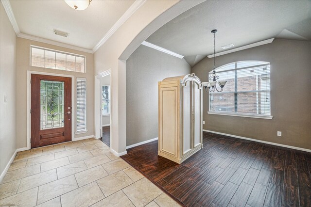 20779 Oakhurst Meadows Dr, Porter, TX 77365 - entrance foyer featuring a chandelier, healthy amount of natural light, arched walkways, crown molding, and wood finished floors