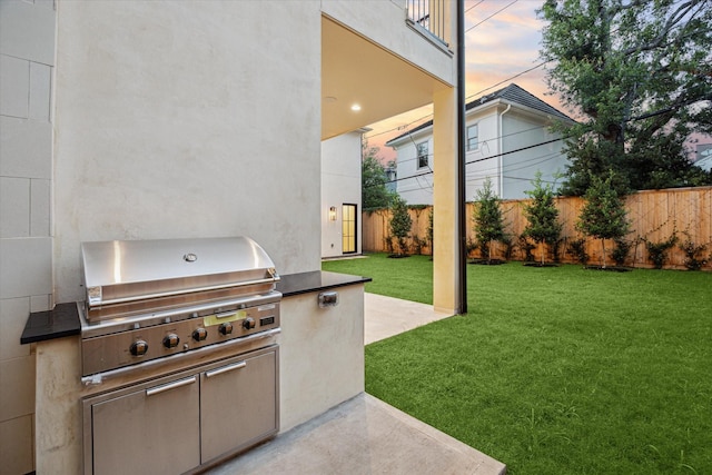 2220 Pelham Dr, Houston, TX 77019 - patio terrace at dusk featuring area for grilling and a patio