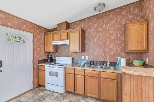 637 Troy St, Anahuac, TX 77514 - kitchen featuring white range with electric stovetop, wallpapered walls, under cabinet range hood, light countertops, and lofted ceiling