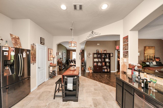 22819 Jetty Manor Ln, Spring, TX 77373 - dining space with arched walkways and recessed lighting