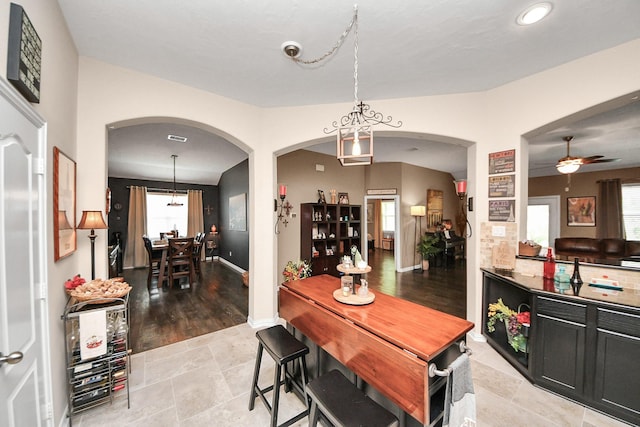 22819 Jetty Manor Ln, Spring, TX 77373 - dining space with arched walkways, a ceiling fan, and recessed lighting