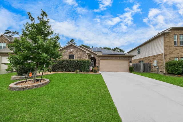 22819 Jetty Manor Ln, Spring, TX 77373 - view of front of property featuring brick siding, solar panels, a garage, and driveway