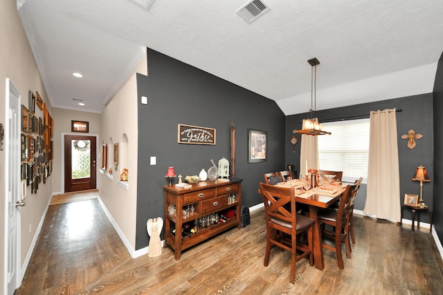 22819 Jetty Manor Ln, Spring, TX 77373 - dining room featuring wood finished floors, a chandelier, ornamental molding, and vaulted ceiling