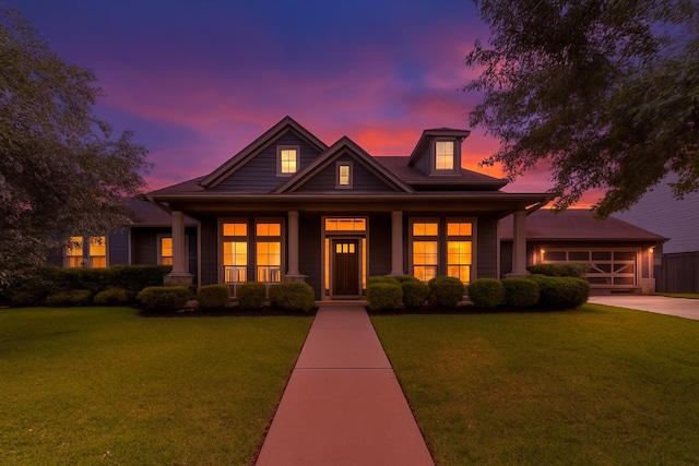 31013 Sunfall Trail Ln, Spring, TX 77386 - view of front facade with a porch, a lawn, a garage, and driveway