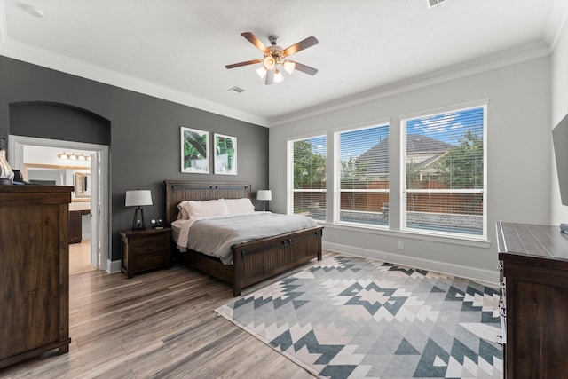 31013 Sunfall Trail Ln, Spring, TX 77386 - bedroom featuring wood finished floors, ornamental molding, ceiling fan, and ensuite bath