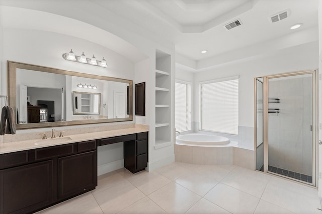 31013 Sunfall Trail Ln, Spring, TX 77386 - bathroom featuring vanity, a bath, a shower stall, built in features, and tile patterned flooring