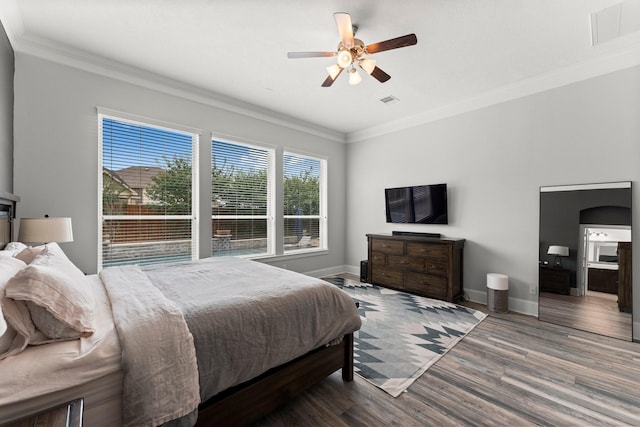 31013 Sunfall Trail Ln, Spring, TX 77386 - bedroom with ornamental molding, wood finished floors, and ceiling fan