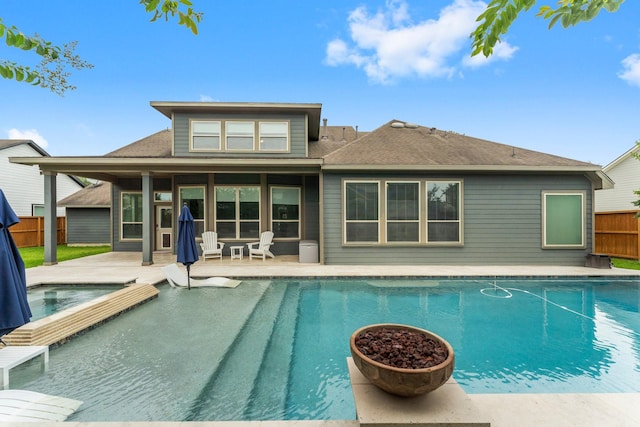 31013 Sunfall Trail Ln, Spring, TX 77386 - back of property with a patio and roof with shingles