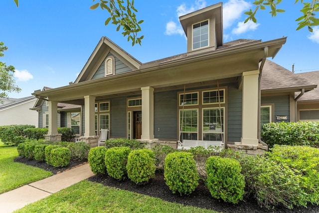 31013 Sunfall Trail Ln, Spring, TX 77386 - view of front of property with a porch, roof with shingles, and a front yard