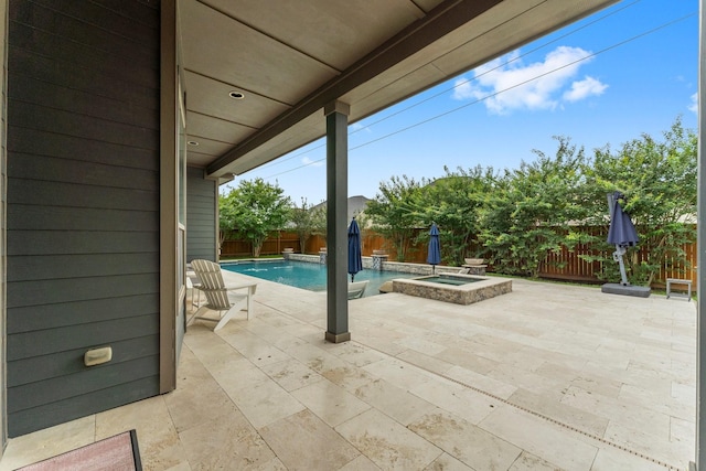 31013 Sunfall Trail Ln, Spring, TX 77386 - fenced backyard featuring a pool with connected hot tub and a patio area